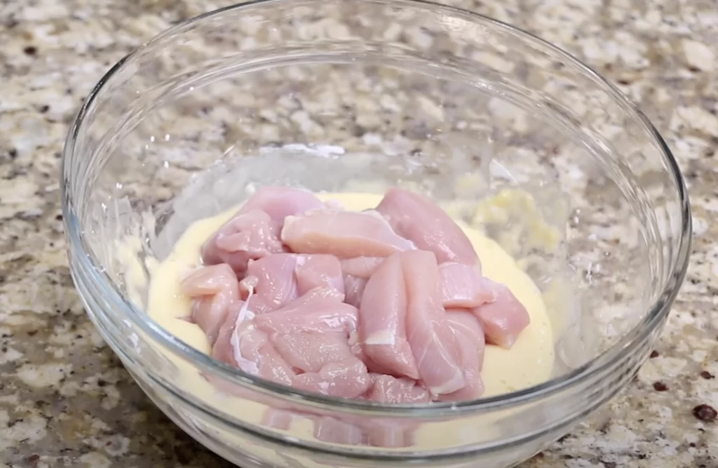 Coating the chicken thighs 